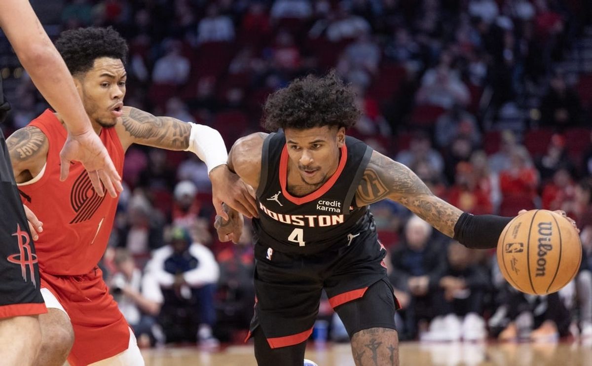 Jan 24, 2024; Houston, Texas, USA; Houston Rockets guard Jalen Green (4) dribbles against Portland Trail Blazers guard Anfernee Simons (1) in the first quarter at Toyota Center.