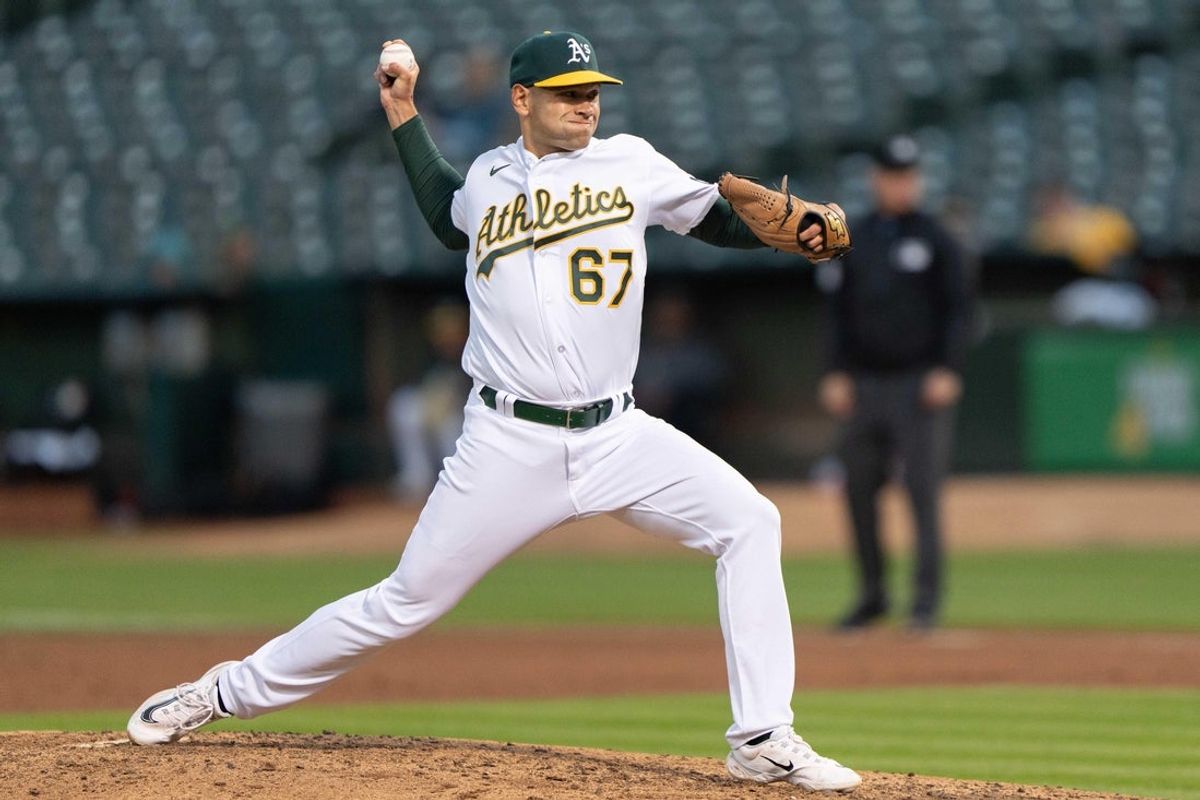 May 16, 2023; Oakland, California, USA; Oakland Athletics relief pitcher Garrett Acton (67) pitches during the fifth inning against the Arizona Diamondbacks at Oakland-Alameda County Coliseum. Mandatory Credit: Stan Szeto-Imagn Images