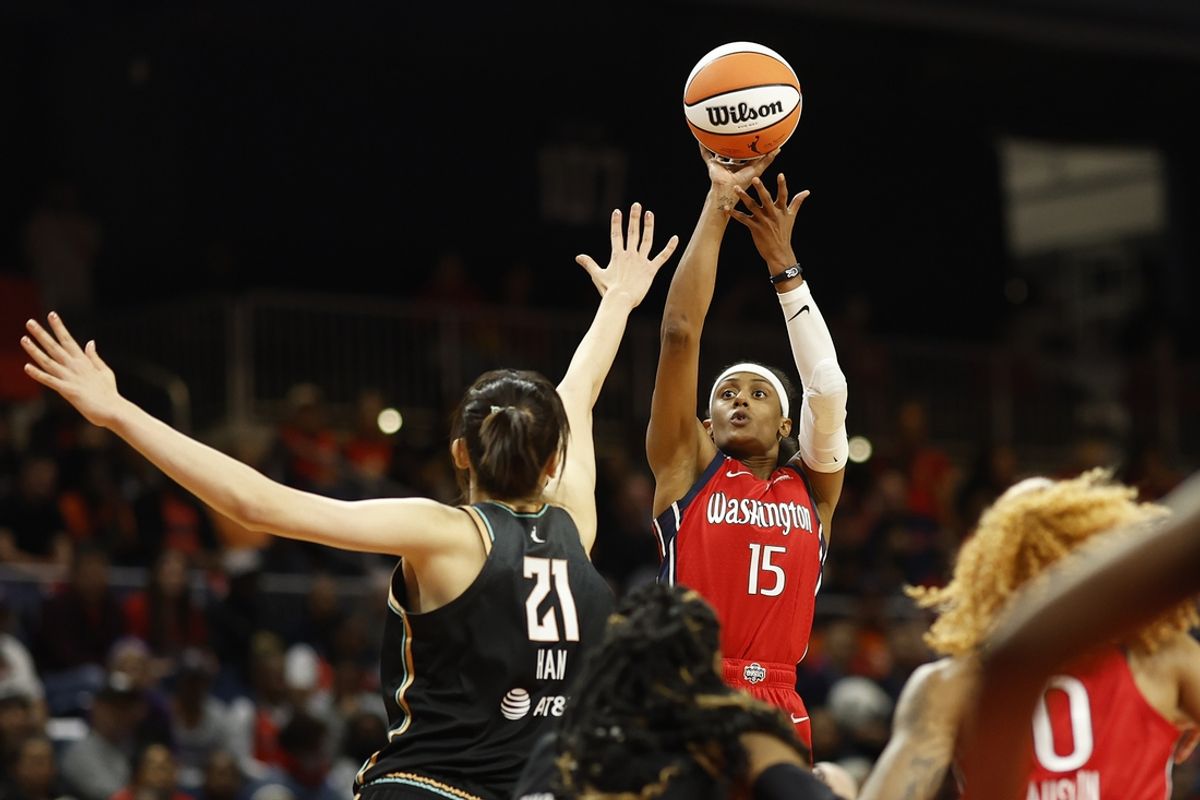 May 19, 2023; Washington, District of Columbia, USA; Washington Mystics guard Brittney Sykes (15) shoots the ball over New York Liberty center Han Xu (21) in the fourth quarter at Entertainment & Sports Arena. Mandatory Credit: Geoff Burke-Imagn Images