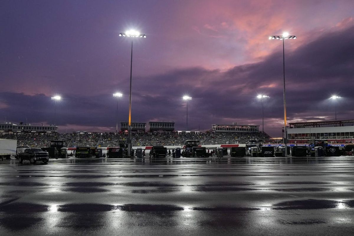 May 20, 2023; North Wilkesboro, North Carolina, USA;  Light rain and sunset mix overhead during the first heat race at North Wilkesboro Speedway. Mandatory Credit: Jim Dedmon-USA TODAY Sports