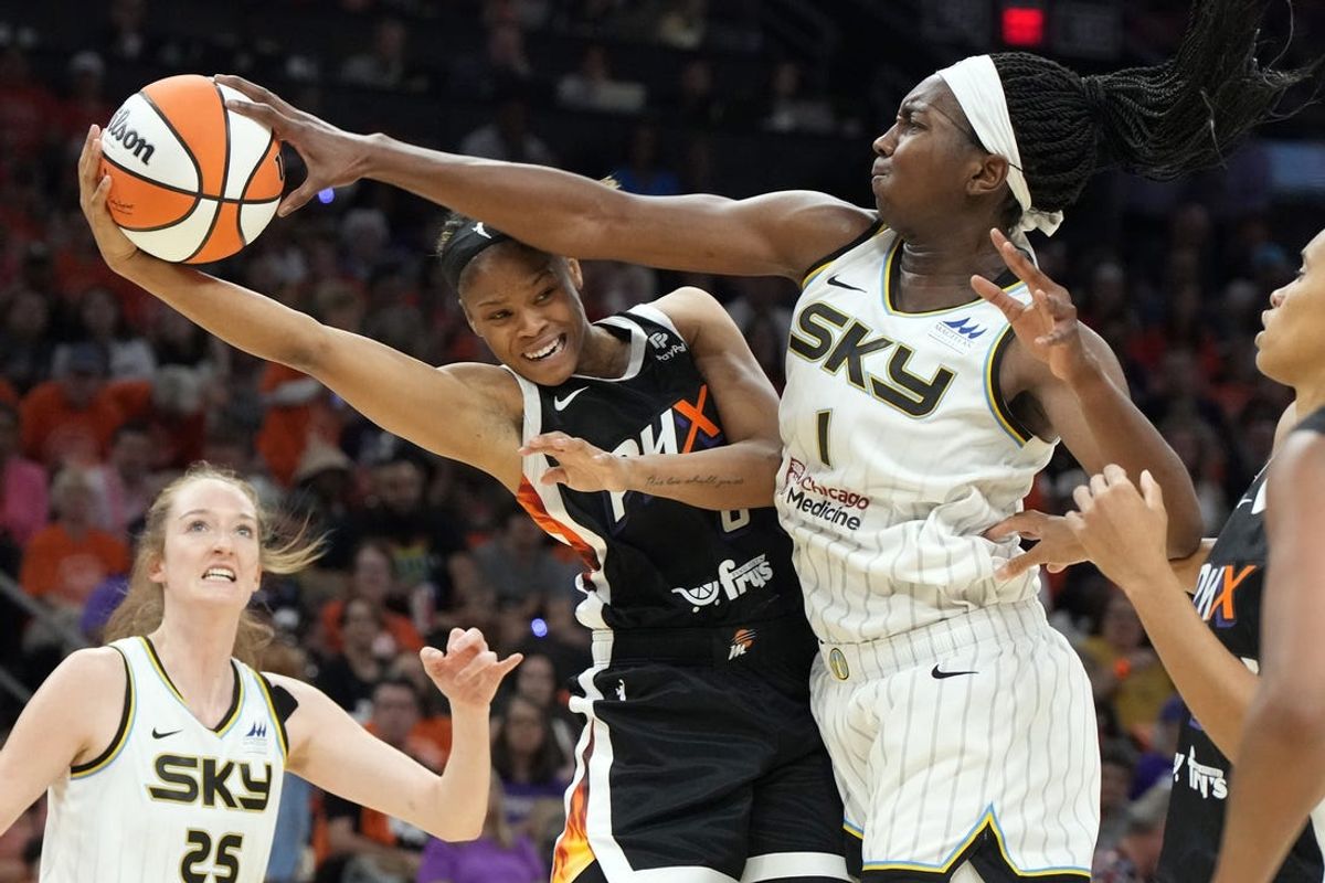 May 21, 2023; Phoenix, Arizona, USA; Chicago Sky center Elizabeth Williams (10) fouls Phoenix Mercury guard Moriah Jefferson (8) in the first half at Footprint Center. Mandatory Credit: Rick Scuteri-USA TODAY Sports