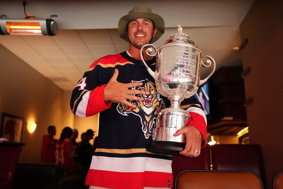 May 22, 2023; Sunrise, Florida, USA; Pro golfer Brooks Koepka poses with the Wanamaker Trophy while attending game three of the Eastern Conference Finals of the 2023 Stanley Cup Playoffs between the Florida Panthers and the Carolina Hurricanes at FLA Live Arena. Mandatory Credit: Jasen Vinlove-USA TODAY Sports