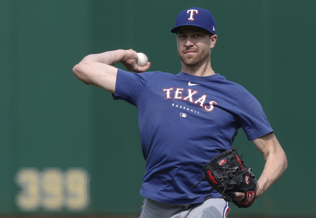May 23, 2023; Pittsburgh, Pennsylvania, USA; Texas Rangers pitcher Jacob deGrom (48) throws in the outfield before the game against the Pittsburgh Pirates at PNC Park. Mandatory Credit: Charles LeClaire-Imagn Images