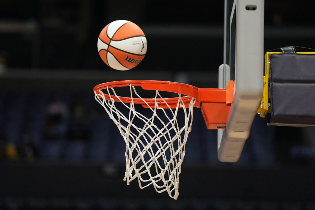 May 25, 2023; Los Angeles, California, USA; Wilson official basketball with WNBA logo goes through the net during the game between the LA Sparks and the Las Vegas Aces at Crypto.com Arena. Mandatory Credit: Kirby Lee-Imagn Images