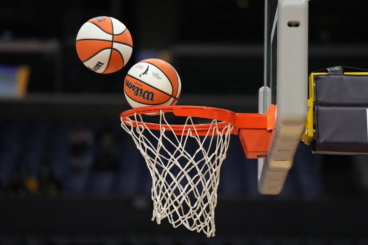 May 25, 2023; Los Angeles, California, USA; Wilson official basketballs with WNBA logo go through the net during the game between the LA Sparks and the Las Vegas Aces at Crypto.com Arena. Mandatory Credit: Kirby Lee-USA TODAY Sports