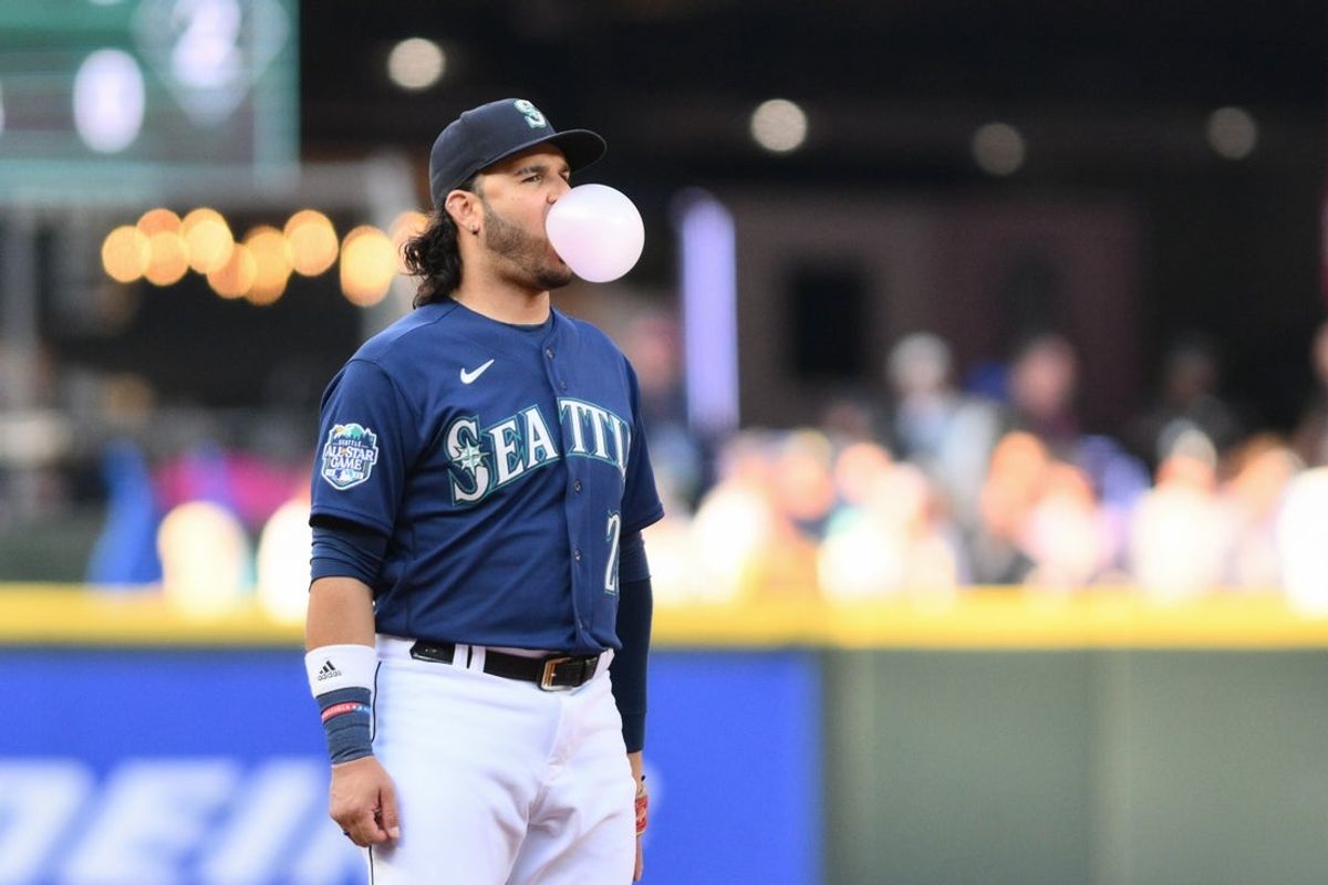 May 24, 2023; Seattle, Washington, USA; Seattle Mariners third baseman Eugenio Suarez (28) blows a bubble during the game against the Oakland Athletics at T-Mobile Park. Mandatory Credit: Steven Bisig-Imagn Images