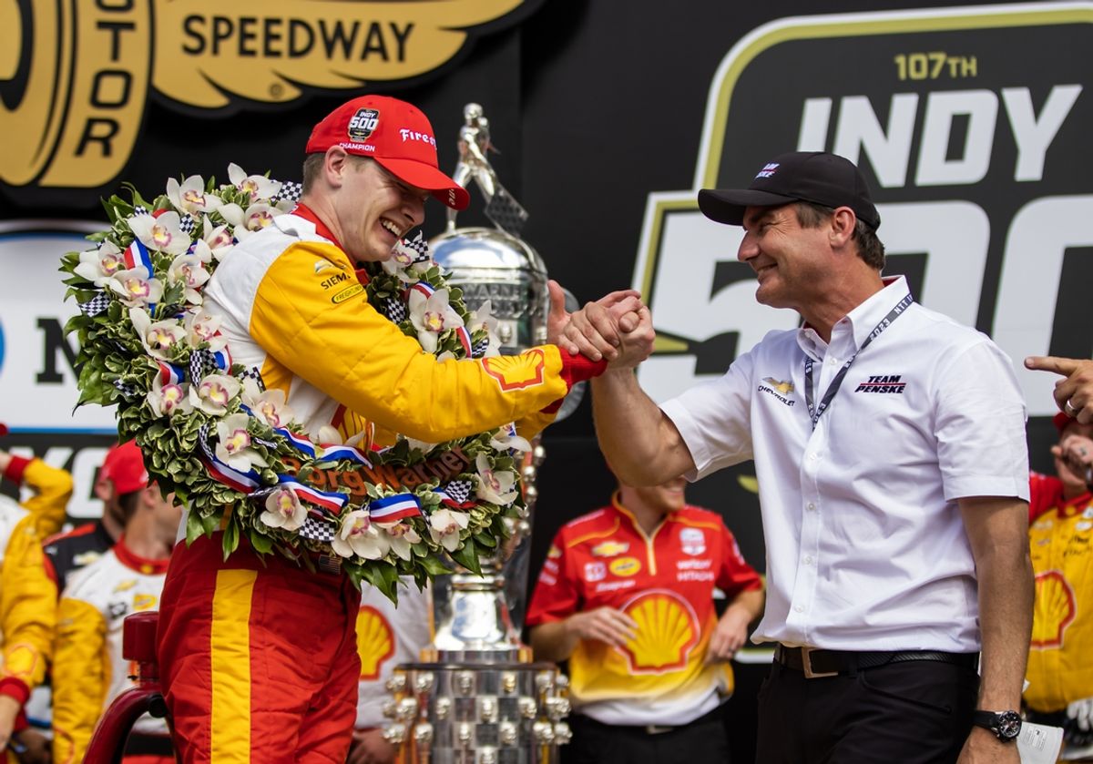 May 28, 2023; Indianapolis, Indiana, USA; IndyCar Series driver Josef Newgarden celebrates with team official Tim Cindric after winning the Indianapolis 500 at Indianapolis Motor Speedway. Mandatory Credit: Mark J. Rebilas-Imagn Images