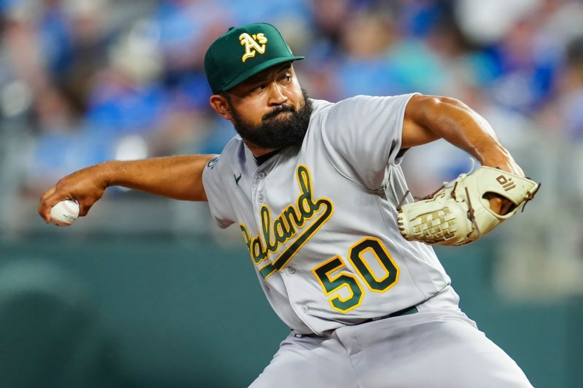 May 6, 2023; Kansas City, Missouri, USA; Oakland Athletics starting pitcher Rico Garcia (50) pitches during the seventh inning against the Kansas City Royals at Kauffman Stadium. Mandatory Credit: Jay Biggerstaff-Imagn Images