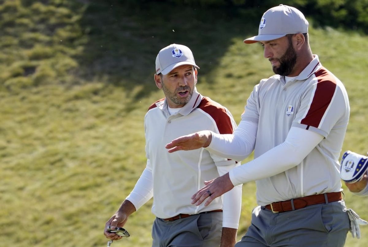Sep 25, 2021; Haven, Wisconsin, USA; Team Europe player Sergio Garcia talks with Team Europe player Jon Rahm after a missed putt on the sixth green during day two four-ball rounds for the 43rd Ryder Cup golf competition at Whistling Straits.