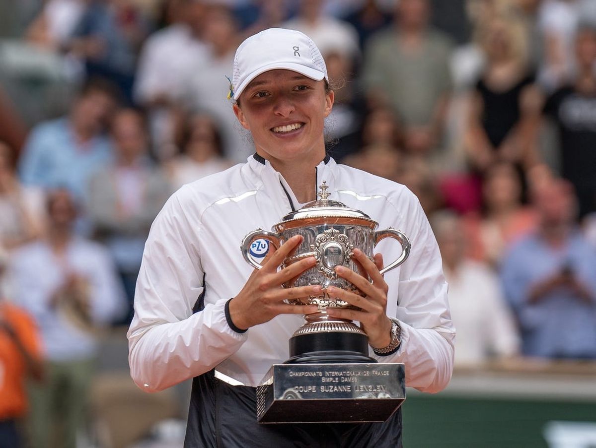 Jun 10, 2023; Paris,France; Iga Swiatek (POL) celebrates with the championship trophy after winning the French Open final against Karolina Muchova (CZE) on day 14 at Stade Roland-Garros. Mandatory Credit: Susan Mullane-USA TODAY Sports