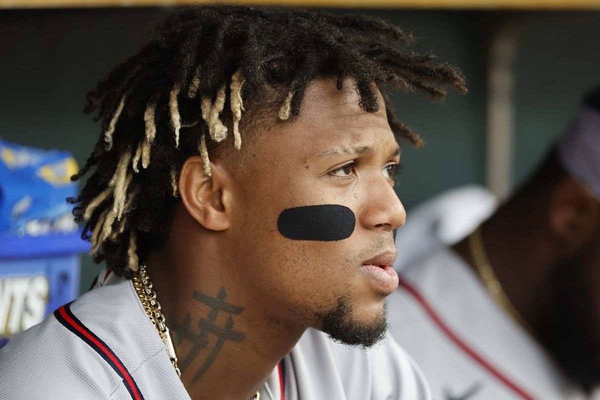 Jun 12, 2023; Detroit, Michigan, USA;  Atlanta Braves right fielder Ronald Acuna Jr. (13) watches from the dugout in the fourth inning against the Detroit Tigers at Comerica Park. Mandatory Credit: Rick Osentoski-Imagn Images