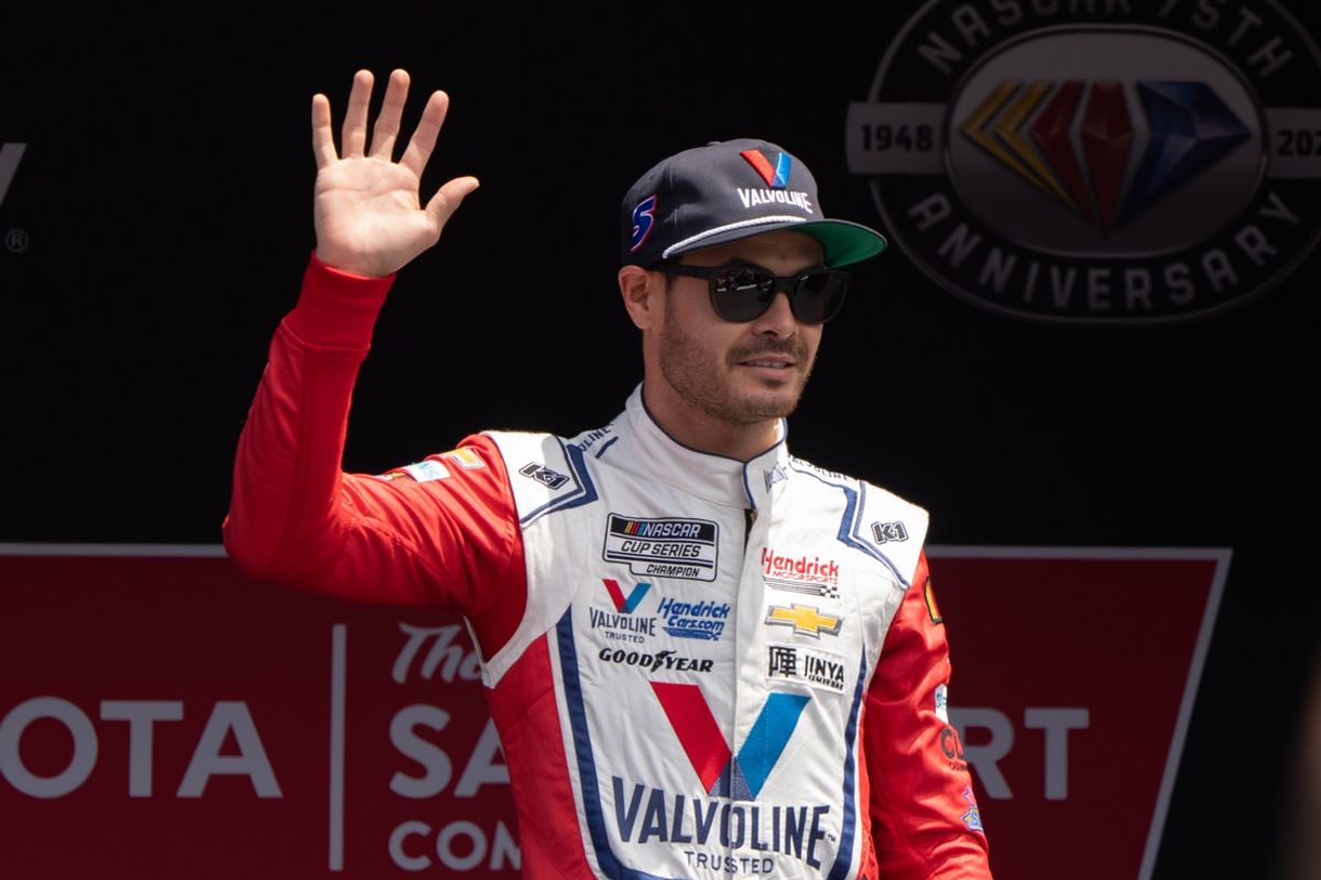 Jun 11, 2023; Sonoma, California, USA;  NASCAR Cup Series driver Kyle Larson (5) waves at the crowd before the start of the Toyota / Save Mart 350 at Sonoma Raceway. Mandatory Credit: Stan Szeto-Imagn Images