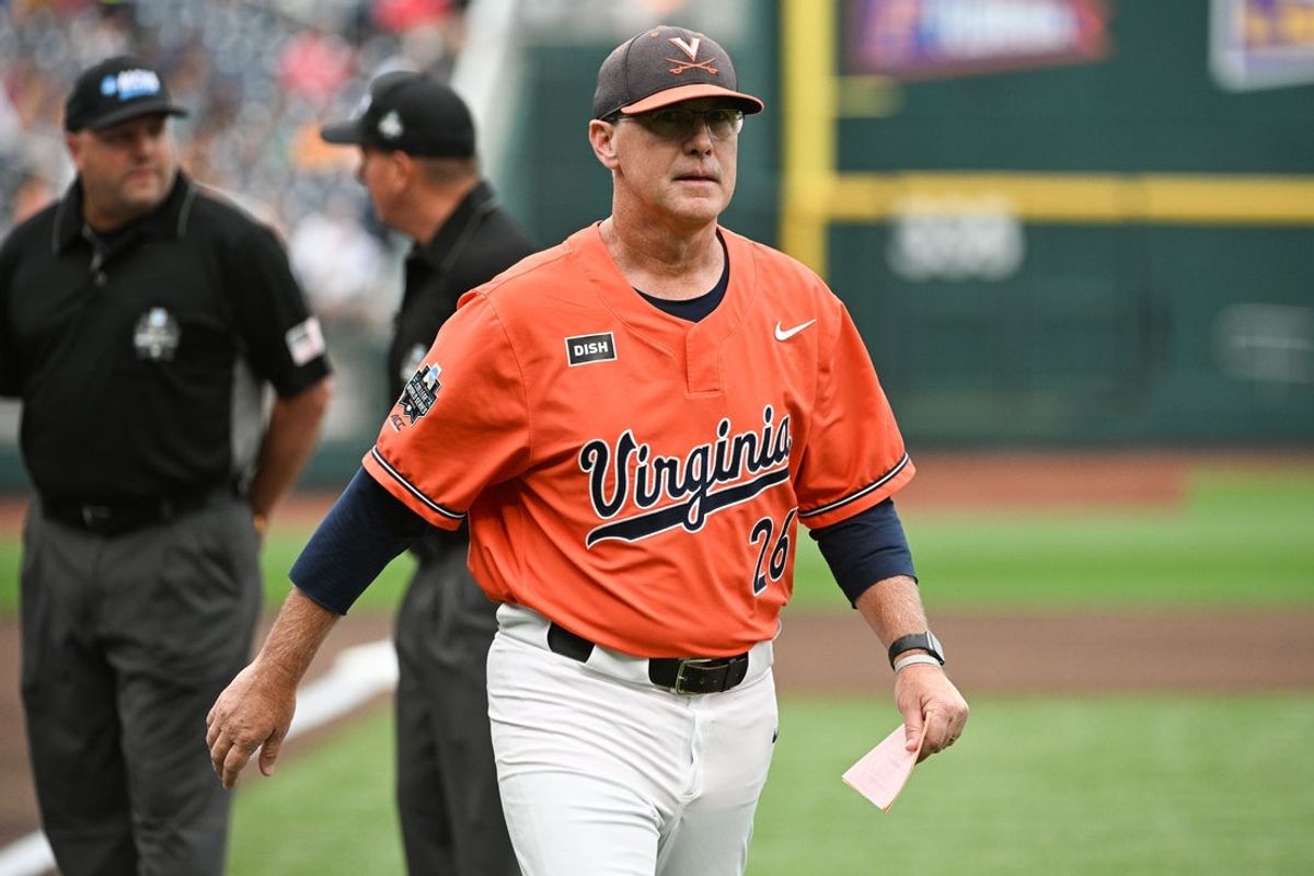 Jun 16, 2023; Omaha, NE, USA;  Virginia Cavaliers head coach Brian O'Connor leaves the meeting with the umpires before the game against the Florida Gators at Charles Schwab Field Omaha. Mandatory Credit: Steven Branscombe-Imagn Images