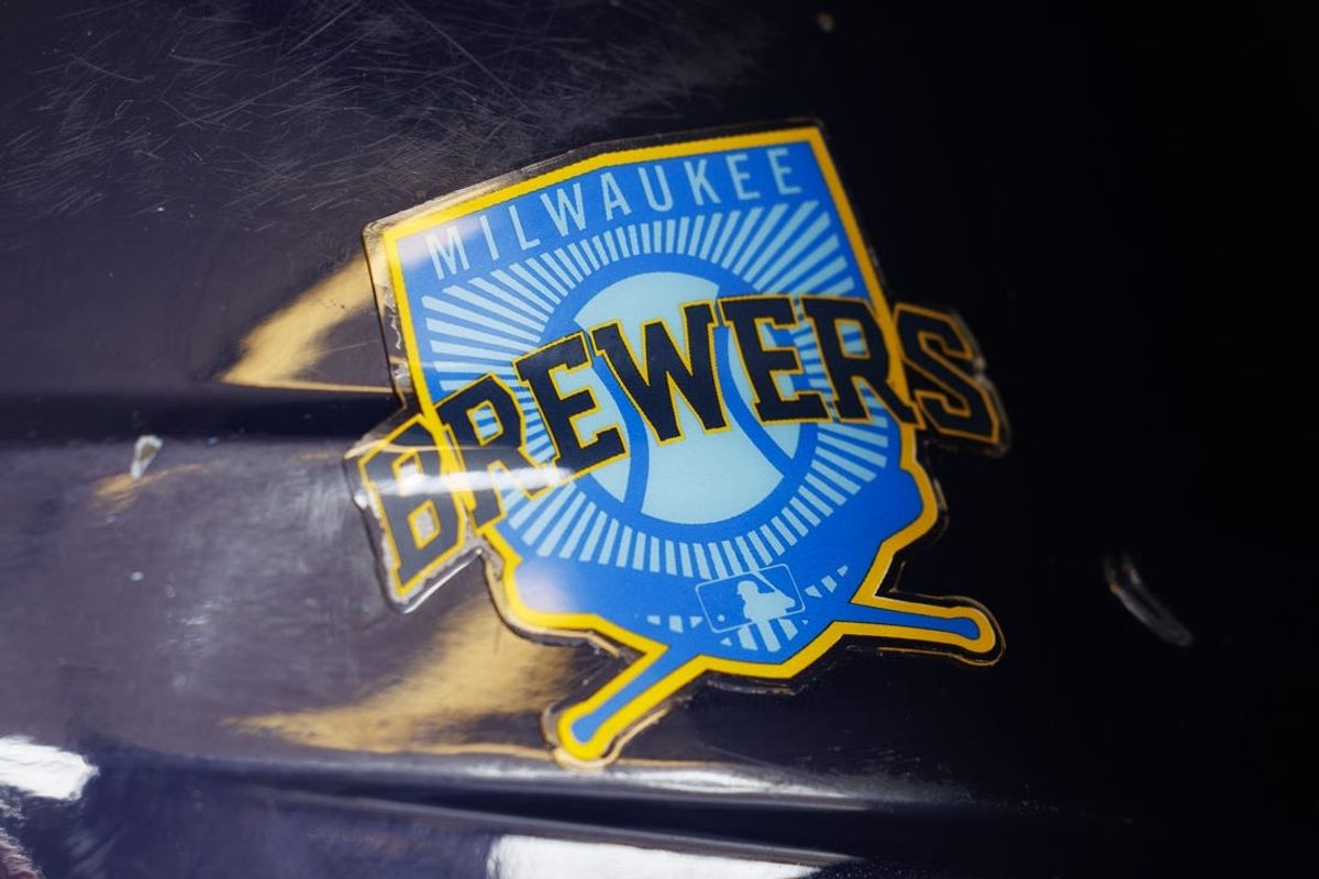 Jun 18, 2023; Milwaukee, Wisconsin, USA;  A Milwaukee Brewers logo on a batting helmet in the dugout prior to the game against the Pittsburgh Pirates at American Family Field. Mandatory Credit: Jeff Hanisch-USA TODAY Sports