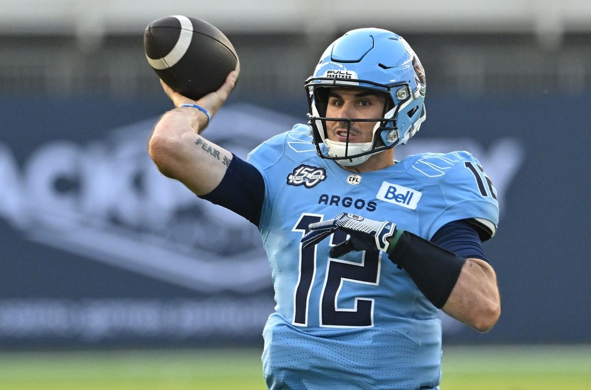 Jun 18, 2023; Toronto, Ontario, CAN;  Toronto Argonauts quarterback Chad Kelly (12) throws a pass against the Hamilton Tiger-Cats in the second quarter at BMO Field. Mandatory Credit: Dan Hamilton-Imagn Images