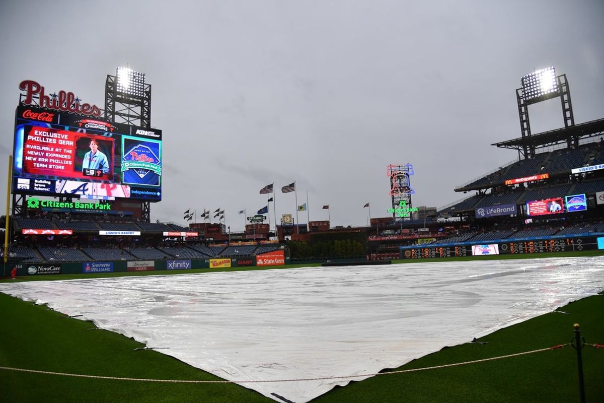 Jun 21, 2023; Philadelphia, Pennsylvania, USA; Tarp covers the infield during rain delay before start of game Philadelphia Phillies and Atlanta Braves at Citizens Bank Park. Mandatory Credit: Eric Hartline-Imagn Images