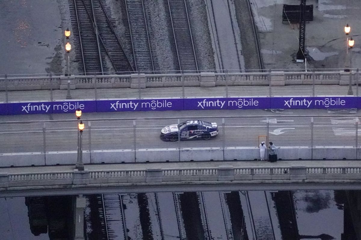 Jul 2, 2023; Chicago, Illinois, USA; NASCAR Cup Series driver Shane Van Gisbergen (91) leads the field on the Balbo Drive bridge on the final lap on his way to win the Grant Park 220 of the Chicago Street Race viewed from the NEMA Chicago buliding. Mandatory Credit: Jon Durr-USA TODAY Sports