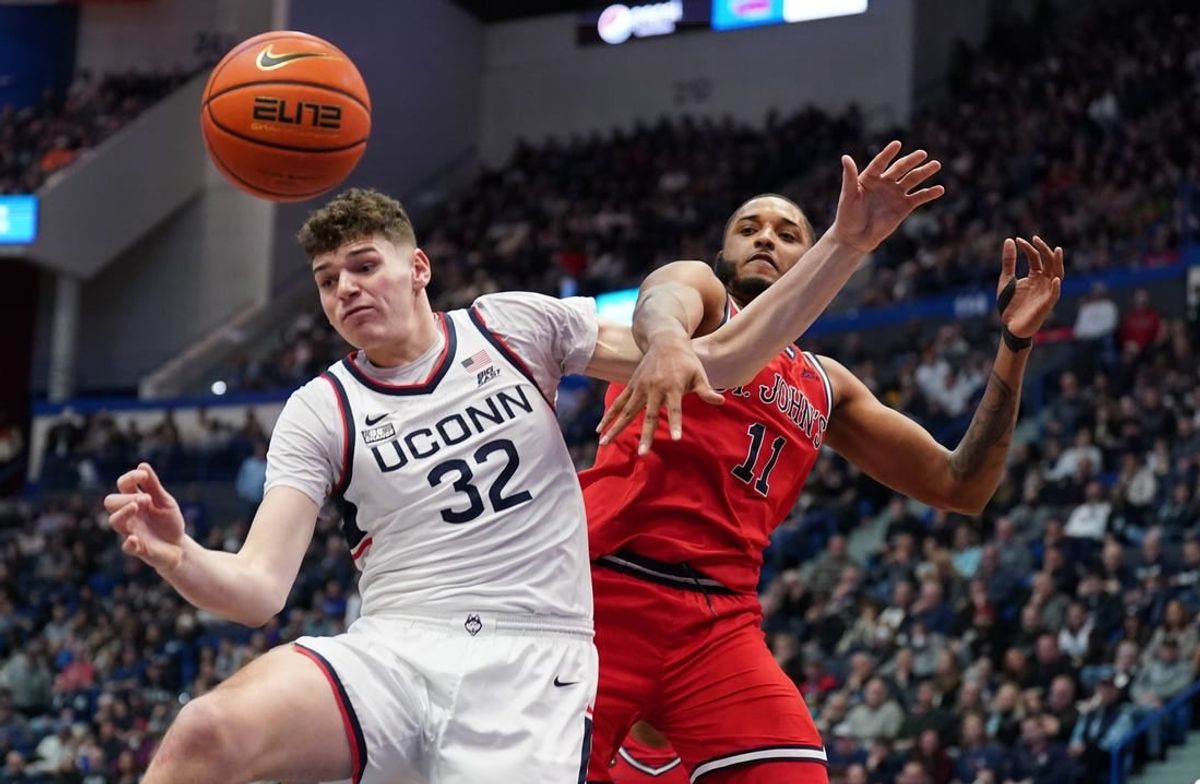 Jan 15, 2023; Hartford, Connecticut, USA; UConn Huskies center Donovan Clingan (32) and St. John's Red Storm center Joel Soriano (11) work for the ball in the second half at XL Center.