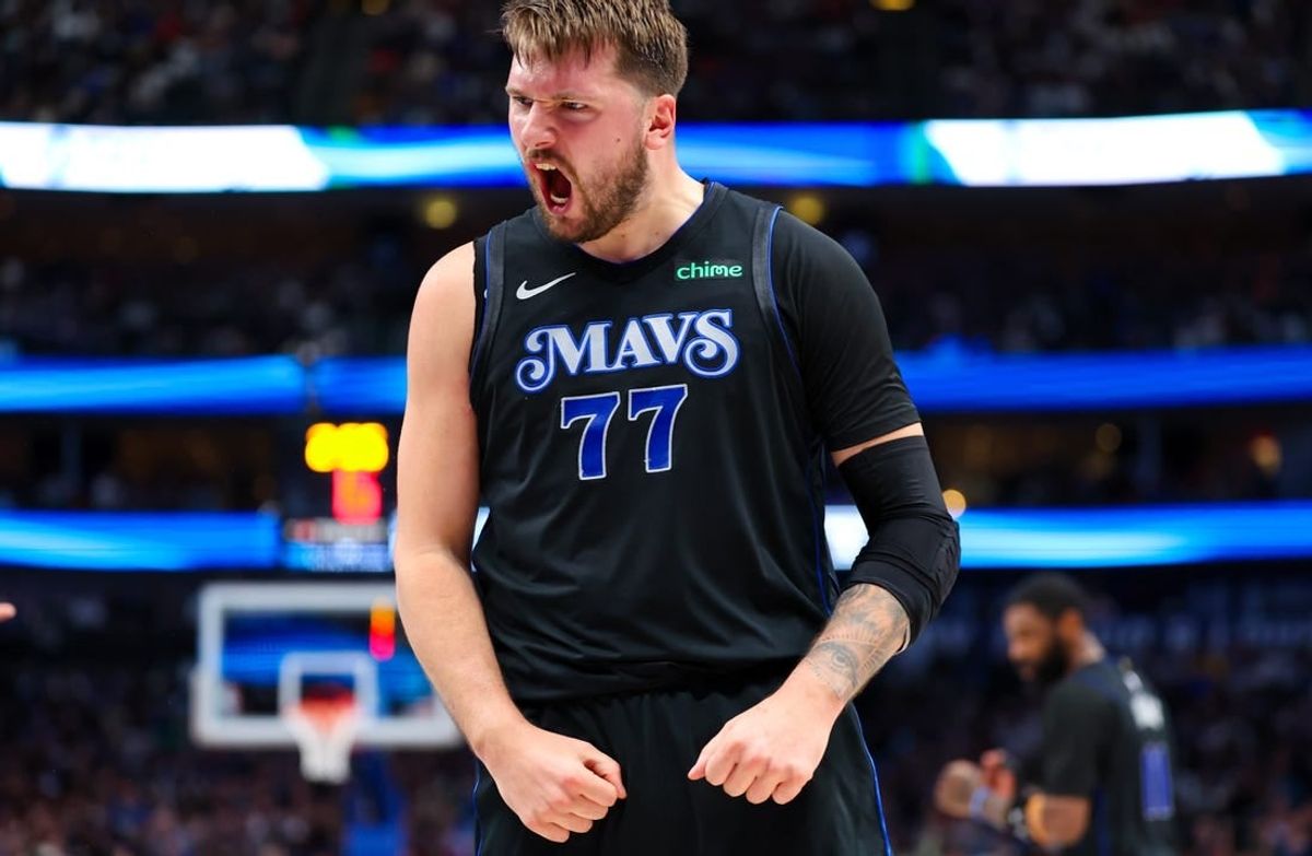Feb 22, 2024; Dallas, Texas, USA;  Dallas Mavericks guard Luka Doncic (77) reacts during the first half against the Phoenix Suns at American Airlines Center.
