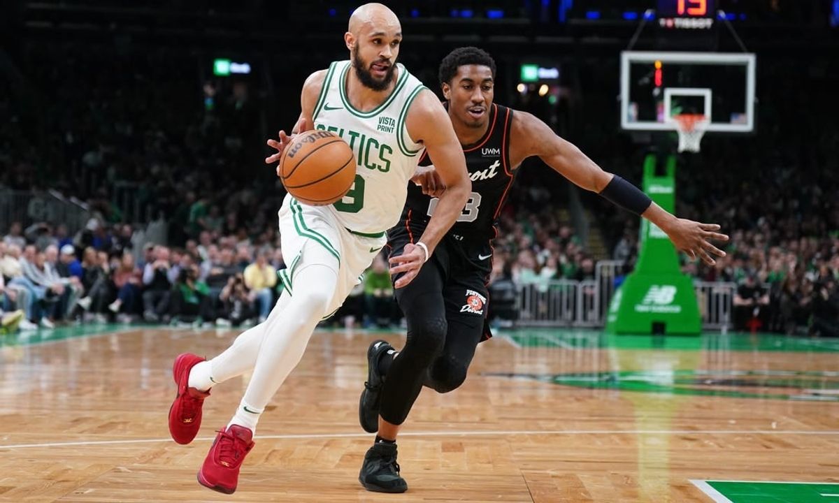 Mar 18, 2024; Boston, Massachusetts, USA; Boston Celtics guard Derrick White (9) drives the ball against Detroit Pistons guard Jaden Ivey (23) in the first quarter at TD Garden.