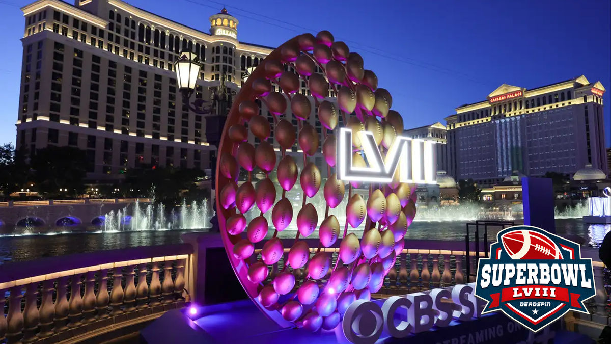 The Fountains of Bellagio launch behind a display of footballs with a 
Super Bowl LVIII logo on the CBS Sports set being built for the game in 
front of Bellagio Resort & Casino on Feb. 3, 2024, in Las Vegas