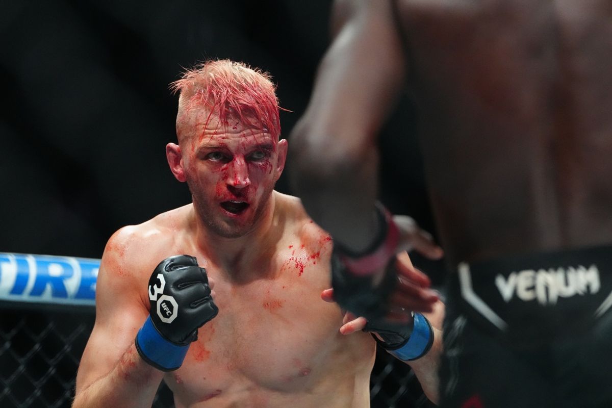 Jul 8, 2023; Las Vegas, Nevada, USA; Jalin Turner (red gloves) fights Dan Hooker (blue gloves) during UFC 290 at T-Mobile Arena. Mandatory Credit: Stephen R. Sylvanie-Imagn Images