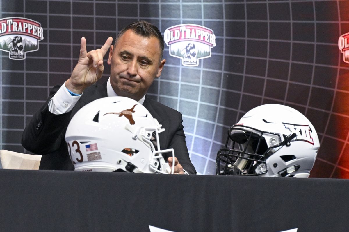 Jul 12, 2023; Arlington, TX, USA; Texas Longhorns head coach Steve Sarkisian flashes the hook em sign as he is interviewed during Big 12 football media day at AT&T Stadium. Mandatory Credit: Jerome Miron-Imagn Images