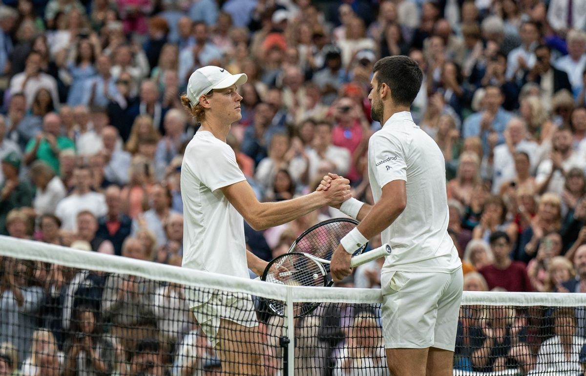 Jul 14, 2023; London, United Kingdom; Novak Djokovic (SRB) and  Jannik Sinner (ITA) at the net after their match on day 12 of Wimbledon at the All England Lawn Tennis and Croquet Club.  Mandatory Credit: Susan Mullane-Imagn Images