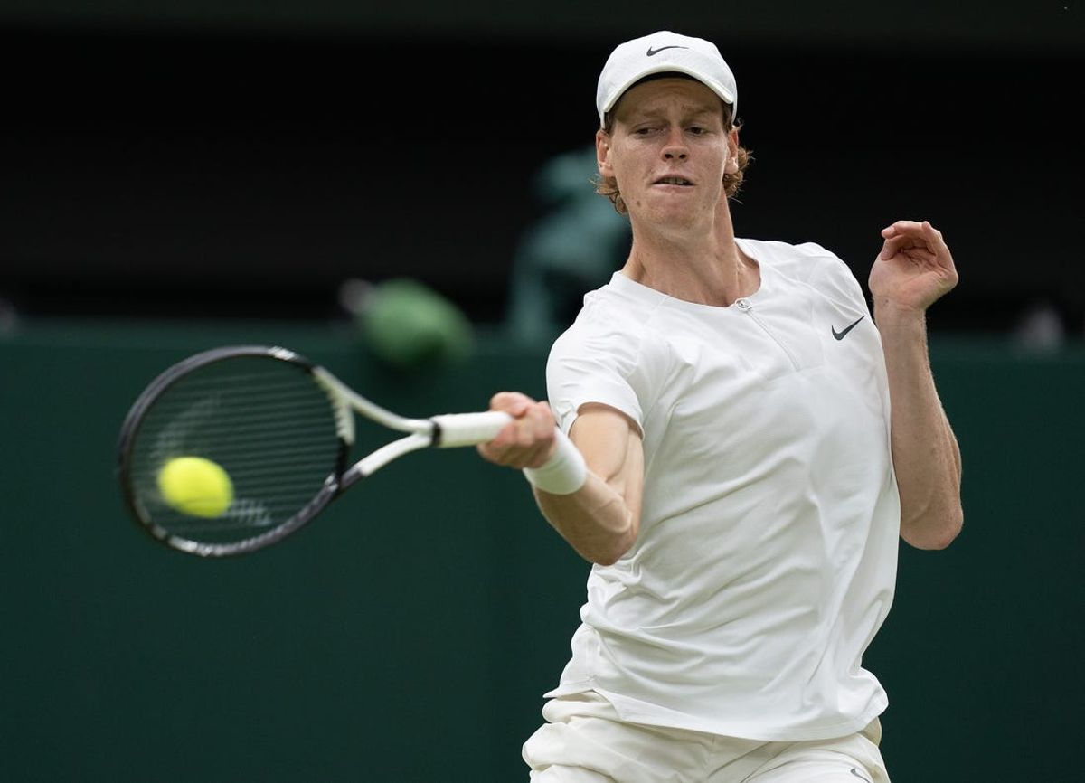 Jul 14, 2023; London, United Kingdom; Jannik Sinner (ITA) returns a shot during his match against Novak Djokovic (SRB) on day 12 at the All England Lawn Tennis and Croquet Club.  Mandatory Credit: Susan Mullane-USA TODAY Sports