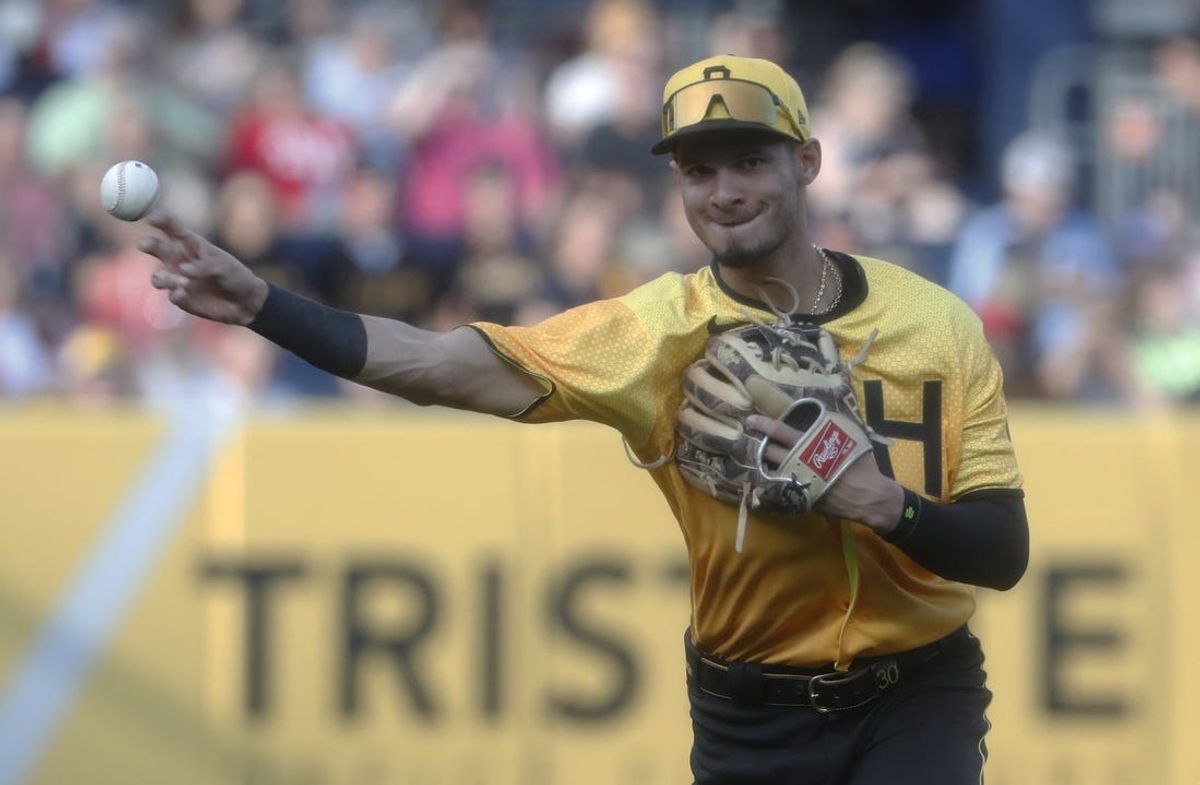 Jul 14, 2023; Pittsburgh, Pennsylvania, USA;  Pittsburgh Pirates shortstop Tucupita Marcano (30) throws to first base to retire San Francisco Giants left fielder Austin Slater (not pictured) during the first inning at PNC Park. Mandatory Credit: Charles LeClaire-USA TODAY Sports
