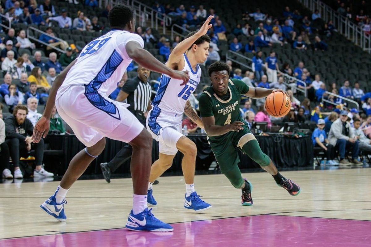 Nov 23, 2023; Kansas City, Missouri, USA; Colorado State Rams guard Isaiah Stevens (4) drives around Creighton Bluejays guard Josiah Dotzler (15) during the second half at T-Mobile Center.