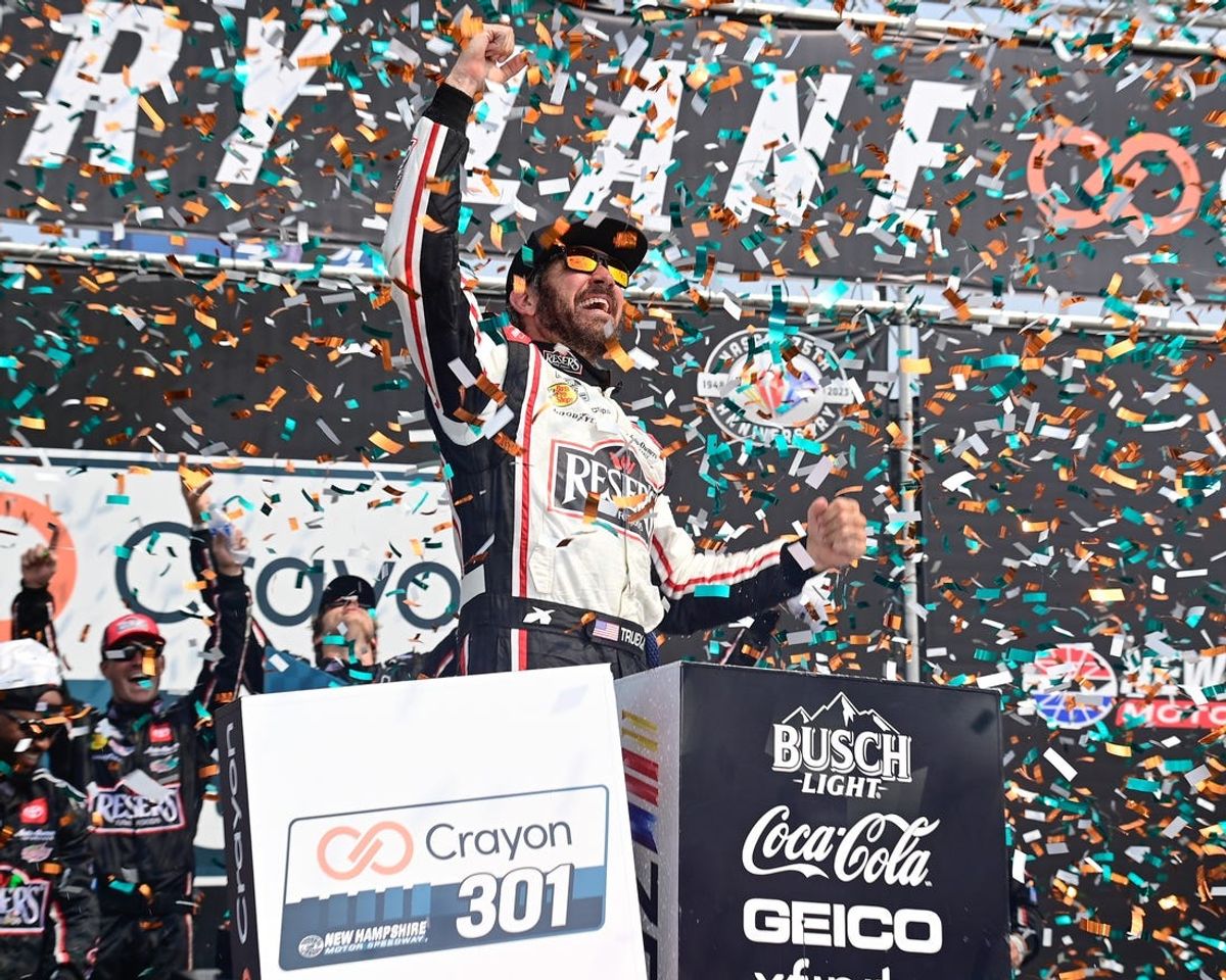 Jul 17, 2023; Loudon, New Hampshire, USA; NASCAR Cup Series driver Martin Truex Jr. (19) celebrates winning the Crayon 301 at New Hampshire Motor Speedway. Mandatory Credit: Eric Canha-USA TODAY Sports