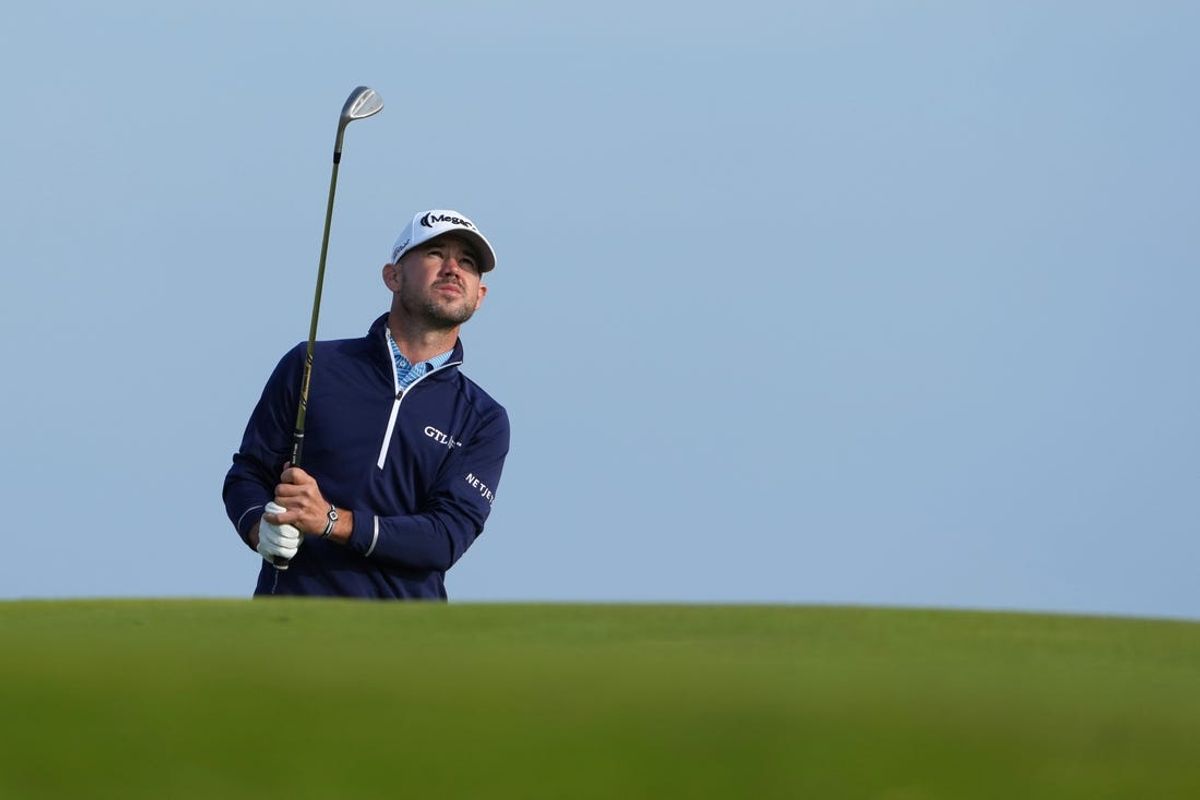 July 20, 2023; Hoylake, England, GBR; Brian Harman plays a shot onto the 17th green during the first round of The Open Championship golf tournament at Royal Liverpool. Mandatory Credit: Kyle Terada-USA TODAY Sports