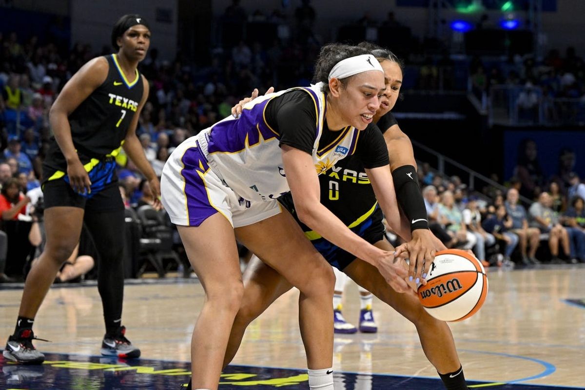 Jul 22, 2023; Arlington, Texas, USA; Los Angeles Sparks forward Dearica Hamby (5) and Dallas Wings forward Satou Sabally (0) battle for the loose ball during the second half at College Park Center. Mandatory Credit: Jerome Miron-USA TODAY Sports