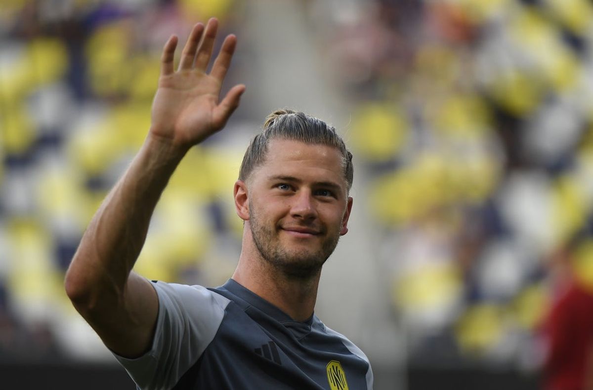 Jul 23, 2023; Nashville, TN, USA; Nashville SC defender Walker Zimmerman (25) waves to fans as he leaves the field after warmups before the match against the Colorado Rapids at GEODIS Park. Mandatory Credit: Christopher Hanewinckel-Imagn Images