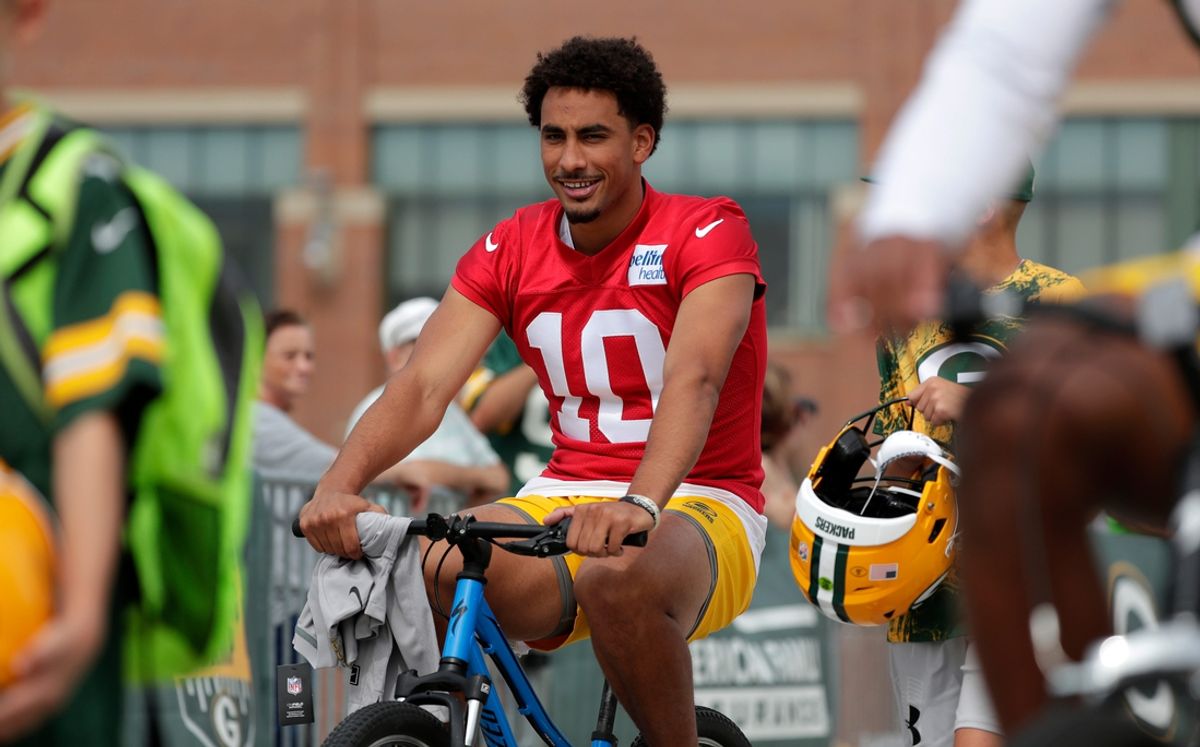Green Bay Packers quarterback Jordan Love (10) participates in the DreamDrive bicycle ride during the first day of training camp on July 26, 2023, in Green Bay, Wis.
