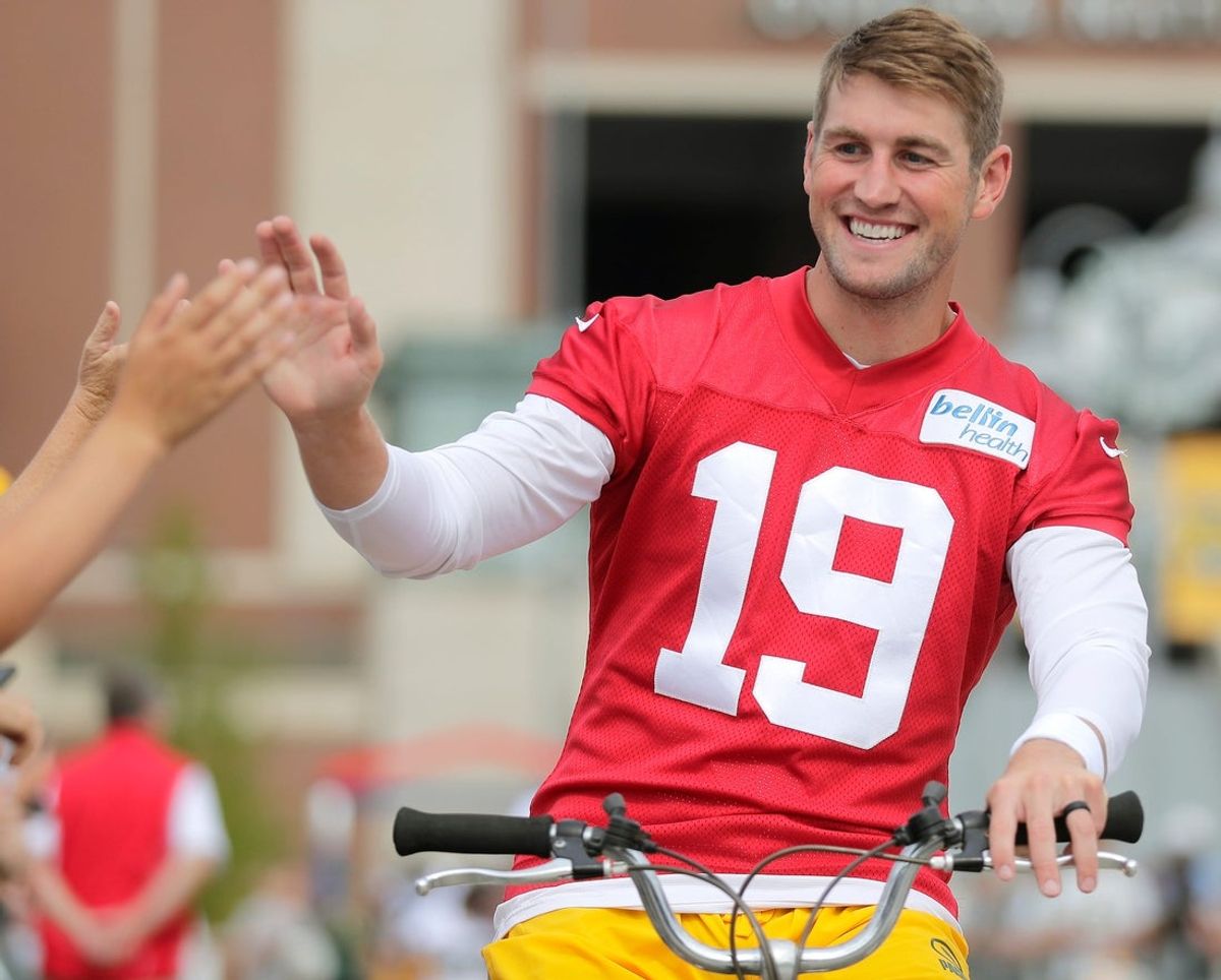 Green Bay Packers quarterback Danny Etling (19) high fives fans on his way to the first day of practice of theGreen Bay Packers    2023 training camp on Wednesday, July 26, 2023 at Ray NitschkeField in Green Bay, Wis. Wm. Glasheen USA TODAY NETWORK-Wisconsin