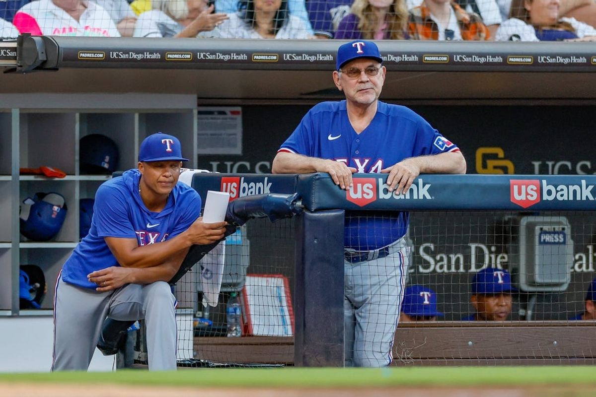 Jul 29, 2023; San Diego, California, USA; Texas Rangers manager Bruce Bochy (15) and associate manager Will Venable (83) watch on as San Diego Padres starting pitcher Yu Darvish (11) pitches during the fifth inning against the San Diego Padres at Petco Park. Mandatory Credit: David Frerker-USA TODAY Sports