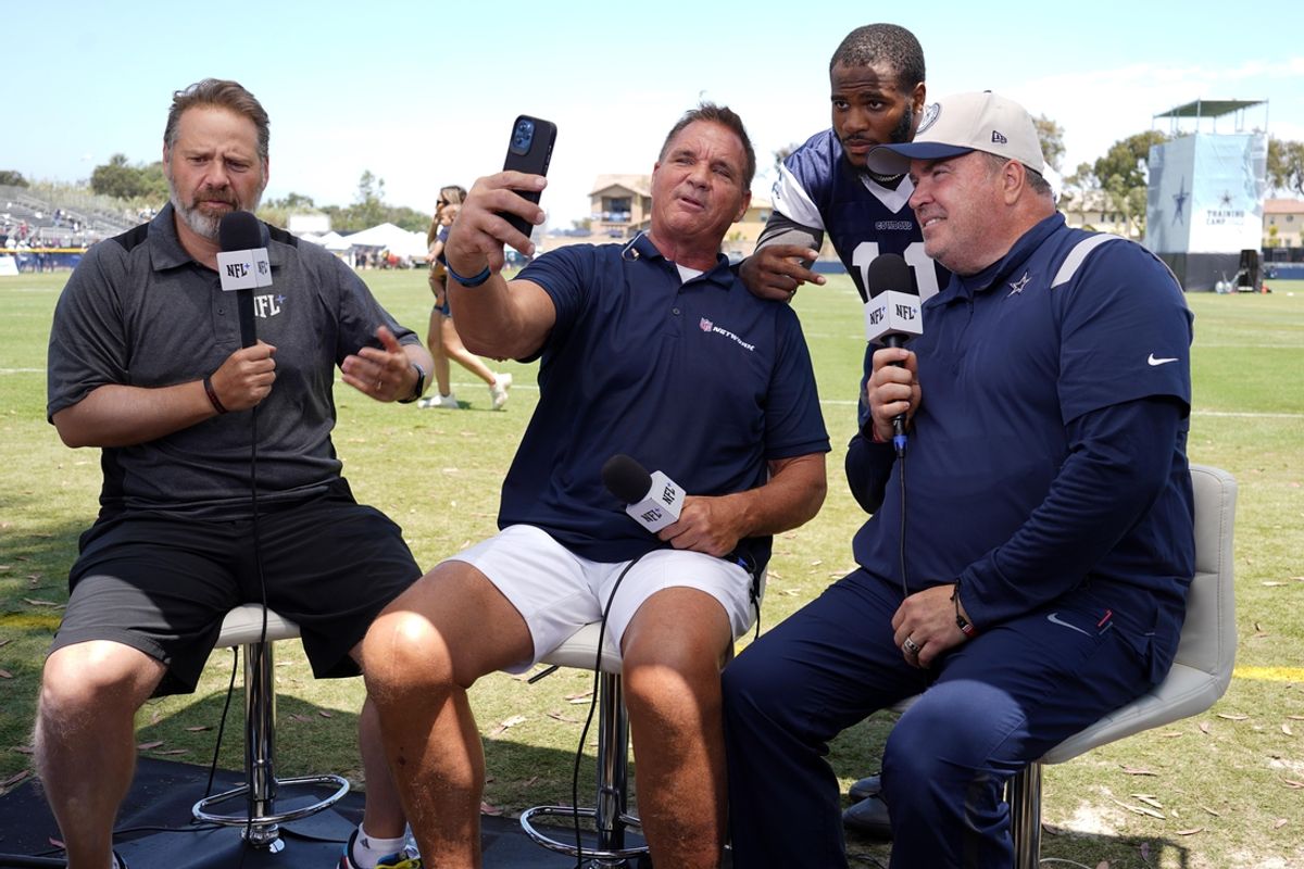 Jul 29, 2023; Oxnard, CA, USA; NFL Network host Chris Rose (left) and analyst Brian Baldinger (second from left) interview Dallas Cowboys linebacker Micah Parsons (11) and coach Mike McCarthy during training camp at the River Ridge Fields. Mandatory Credit: Kirby Lee-Imagn Images
