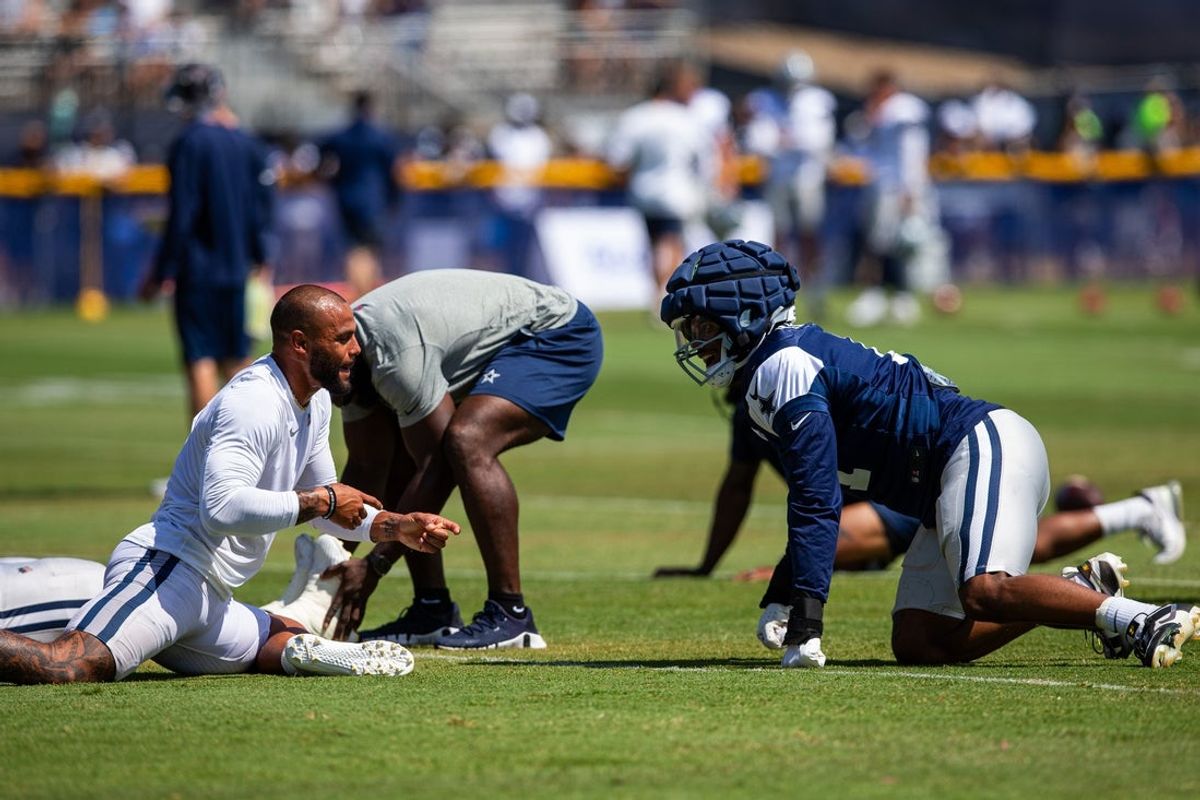 Dallas Cowboys quarterback Dak Prescott (4) and linebacker Micah Parsons (11) during training camp at Marriott Residence Inn-River Ridge playing fields. Mandatory Credit: Jason Parkhurst-Imagn Images