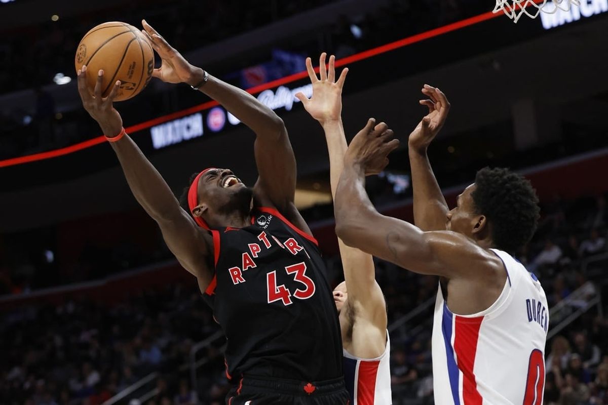 Dec 30, 2023; Detroit, Michigan, USA;  Toronto Raptors forward Pascal Siakam (43) shoots on Detroit Pistons center Jalen Duren (0) in the second half at Little Caesars Arena.
