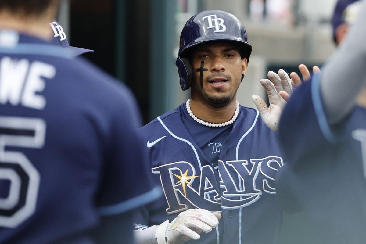 Aug 6, 2023; Detroit, Michigan, USA; Tampa Bay Rays shortstop Wander Franco (5) receives congratulations from teammates after scoring in the sixth inning against the Detroit Tigers at Comerica Park. Mandatory Credit: Rick Osentoski-Imagn Images