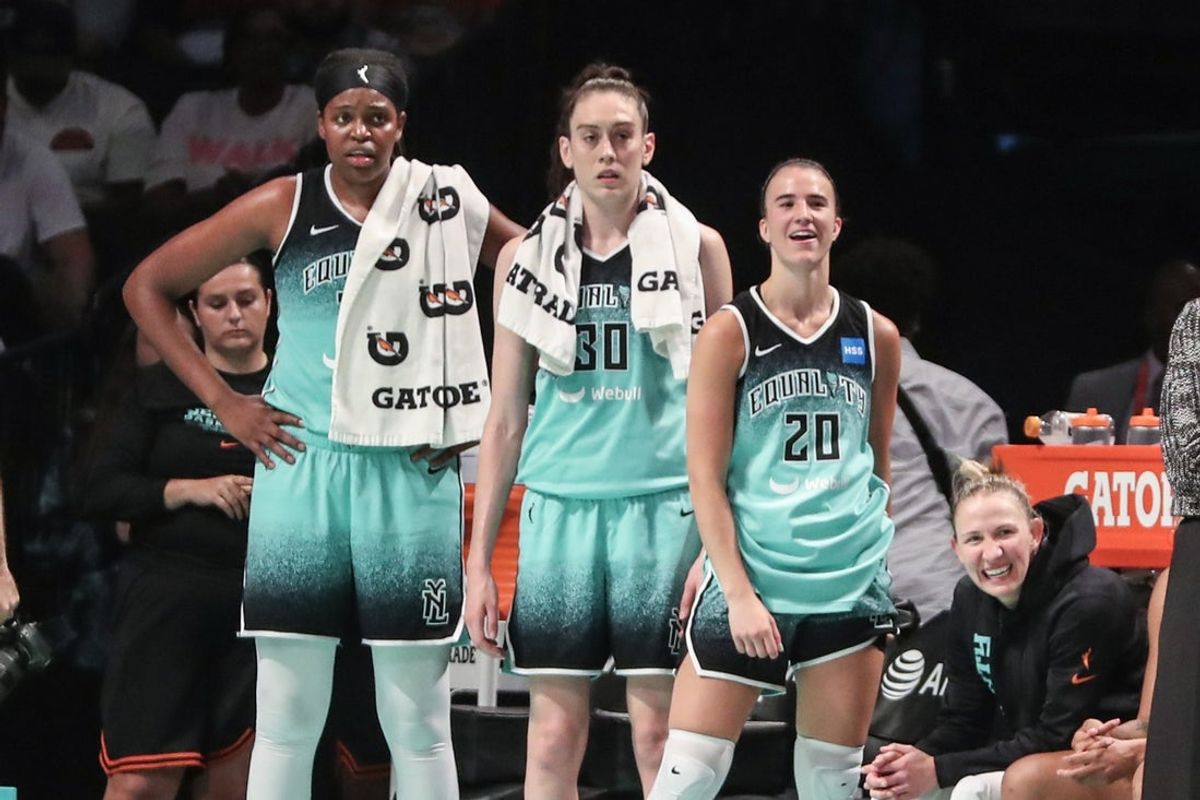 Aug 6, 2023; Brooklyn, New York, USA; New York Liberty forwards Jonquel Jones (35) and Breanna Stewart (30) and guard Sabrina Ionescu (20) watch the game from the bench in the fourth quarter against the Las Vegas Aces at Barclays Center. Mandatory Credit: Wendell Cruz-Imagn Images