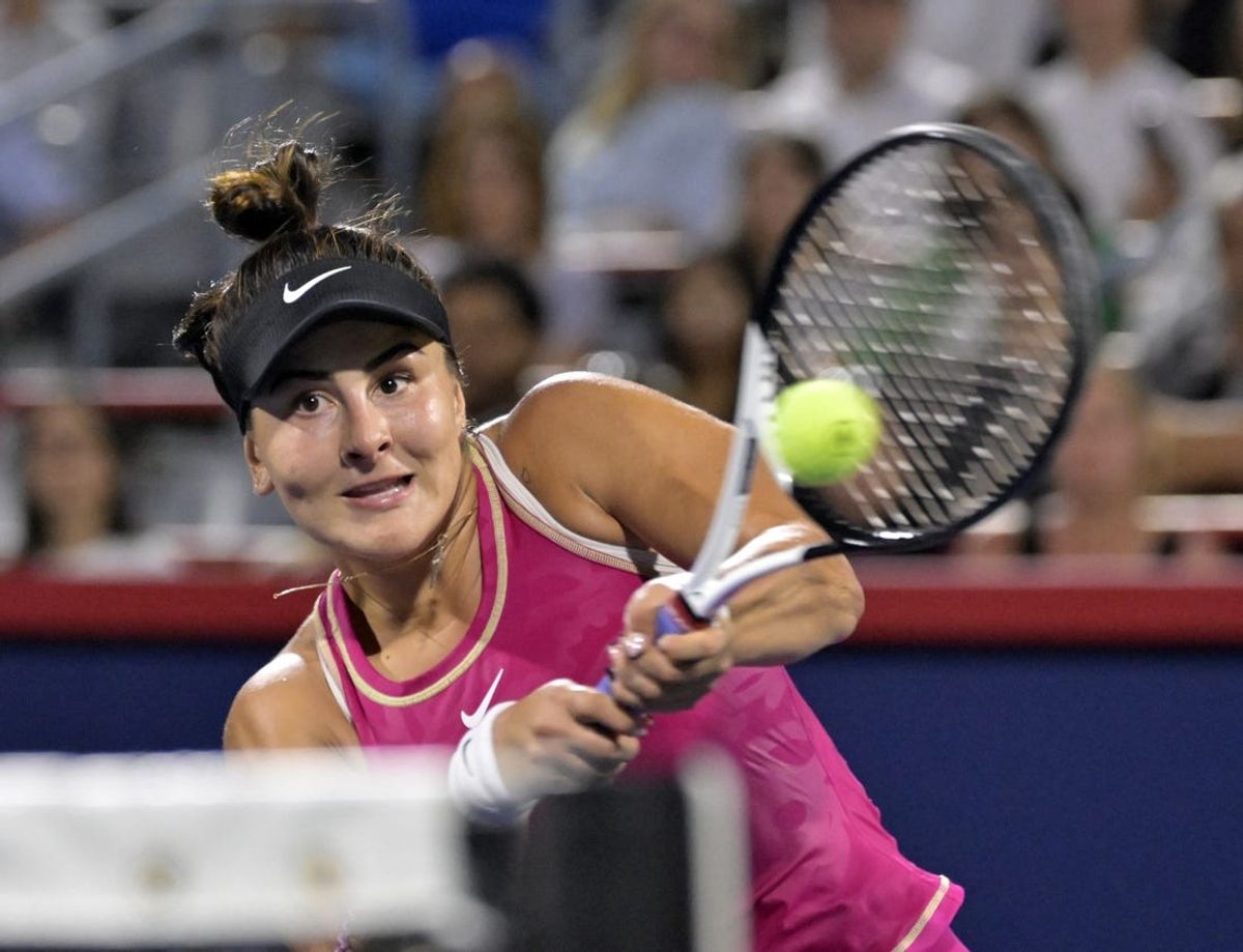 Aug 8, 2023; Montreal, Quebec, Canada; Bianca Andreescu (CAN) hits a volley Camila Giorgi (ITA) (not pictured) during first round play at IGA Stadium. Mandatory Credit: Eric Bolte-USA TODAY Sports