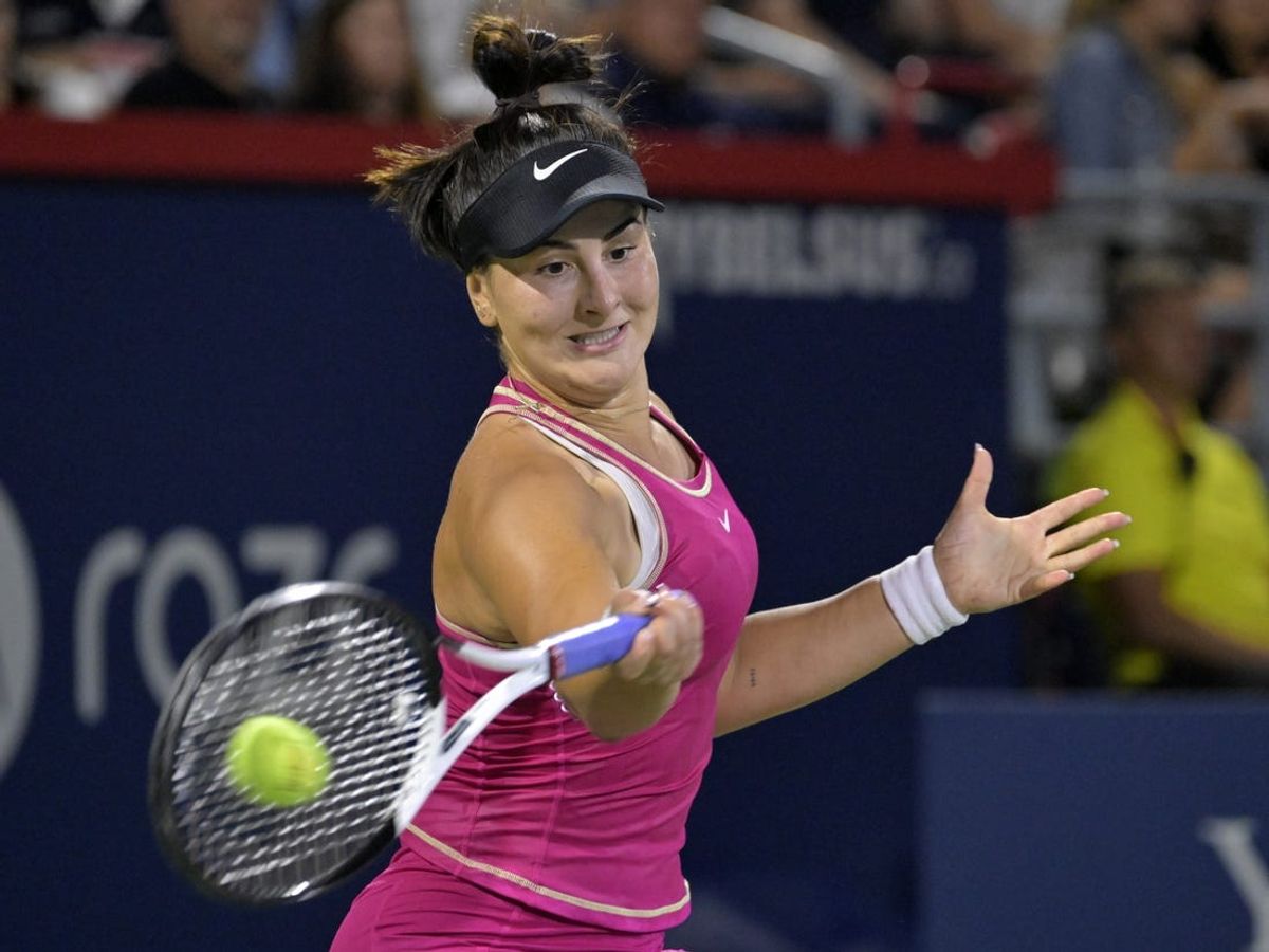 Aug 8, 2023; Montreal, Quebec, Canada; Bianca Andreescu (CAN) hits a forehand against Camila Giorgi (ITA) (not pictured) during first round play at IGA Stadium. Mandatory Credit: Eric Bolte-USA TODAY Sports