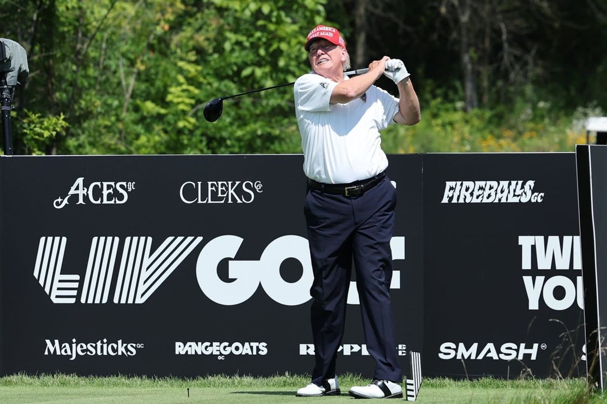 Aug 9, 2023; Bedminster, New Jersey, USA;  Former President Donald Trump takes a swing during a practice round of the LIV Golf Bedminster golf tournament at Trump National Bedminster. Mandatory Credit: Vincent Carchietta-Imagn Images