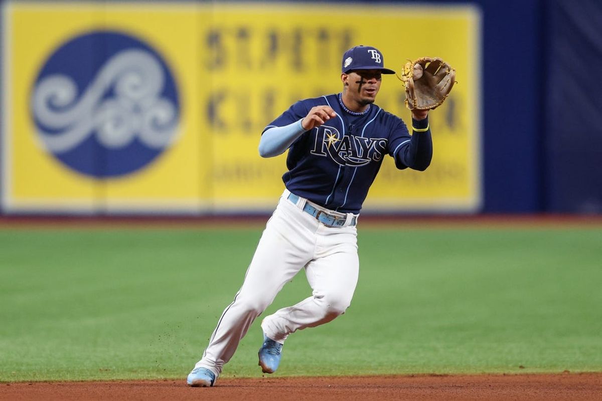 Aug 9, 2023; St. Petersburg, Florida, USA;  Tampa Bay Rays shortstop Wander Franco (5) fields the bal for an out against the St. Louis Cardinals in the eighth inning at Tropicana Field. Mandatory Credit: Nathan Ray Seebeck-USA TODAY Sports