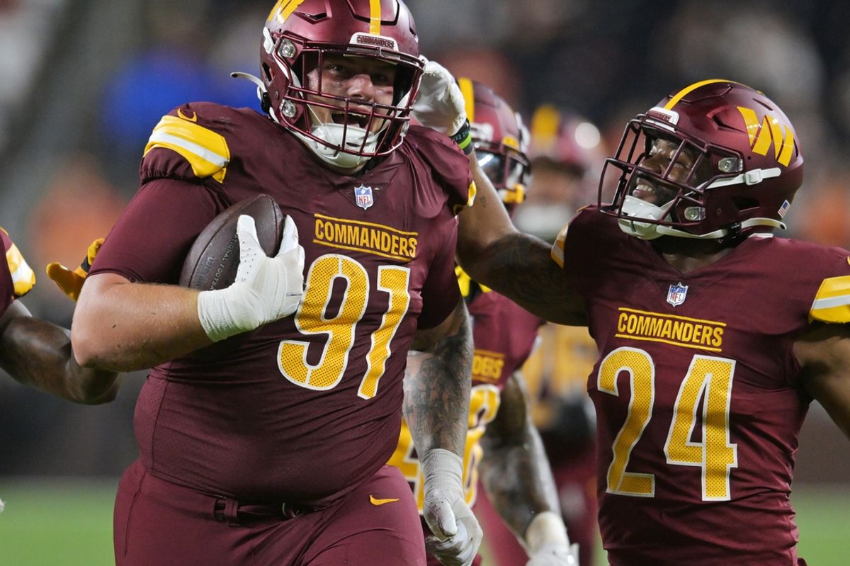 Aug 11, 2023; Cleveland, Ohio, USA; Washington Commanders defensive tackle John Ridgeway (91) and safety Terrell Burgess (24) celebrate after Ridgeway recovered a fumble during the second half against the Cleveland Browns at Cleveland Browns Stadium. Mandatory Credit: Ken Blaze-USA TODAY Sports