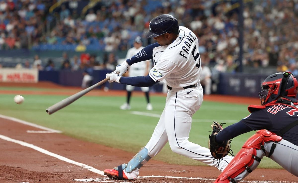Aug 12, 2023; St. Petersburg, Florida, USA;  Tampa Bay Rays shortstop Wander Franco (5) singles against the Cleveland Guardians during the first inning at Tropicana Field. Mandatory Credit: Kim Klement Neitzel-Imagn Images