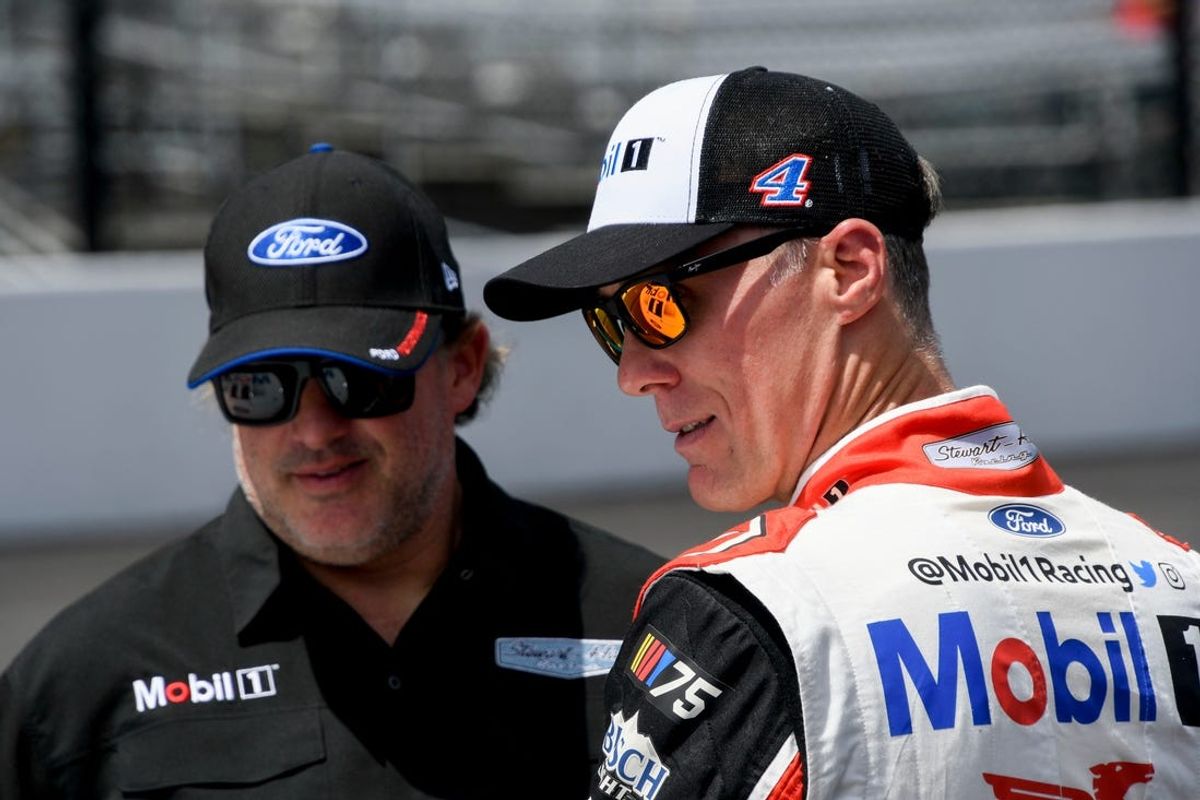 NASCAR Cup Series driver Kevin Harvick (4) talks with one of his team owners Tony Stewart on Sunday, Aug. 13, 2023, ahead of the Verizon 200 at the Brickyard at Indianapolis Motor Speedway.
